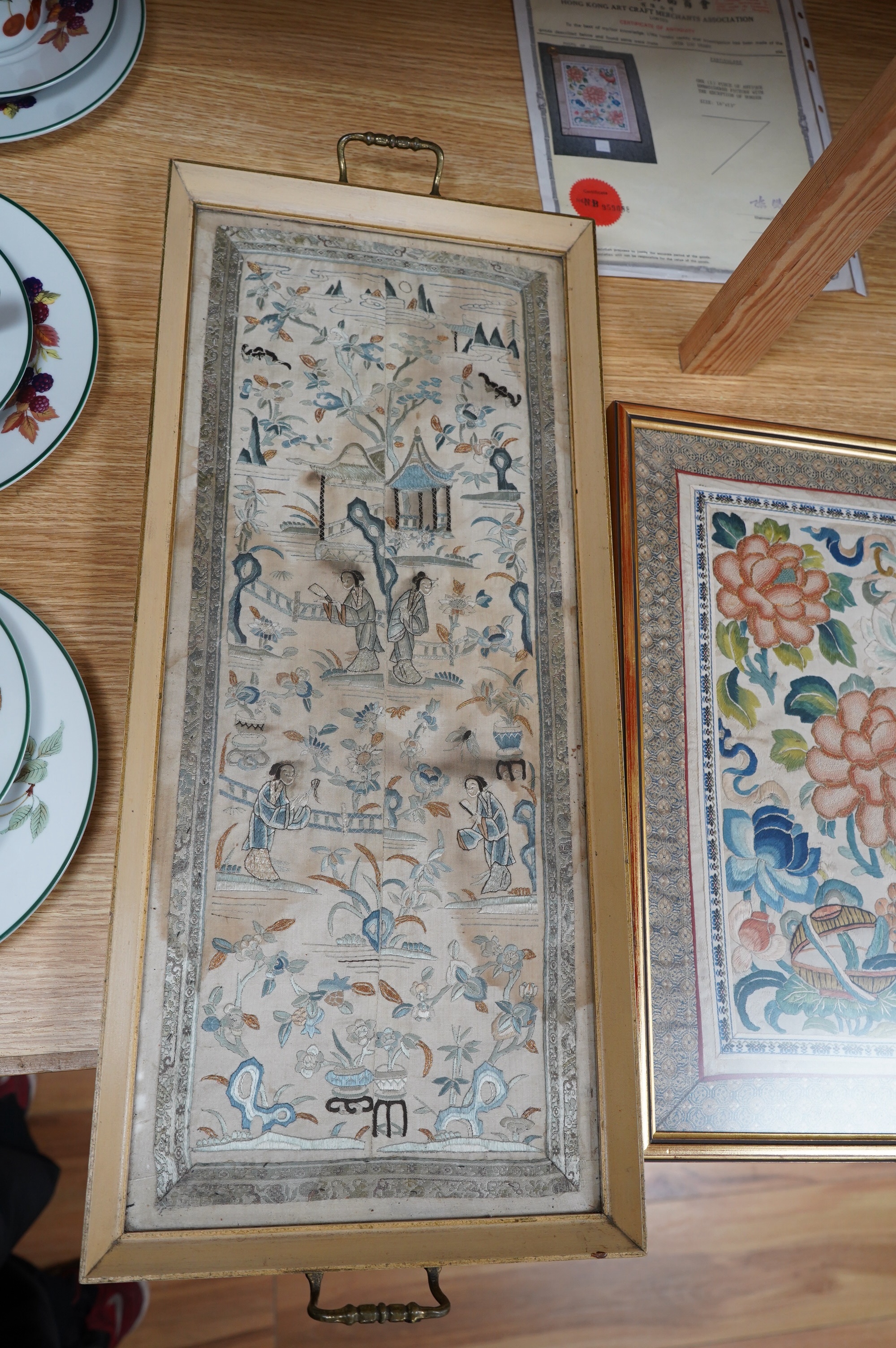 A framed pair of late 19th century embroidered sleeve bands now as a tray and a framed Chinese knot floral silk embroidery, Chinese knot embroidery 30.5cm wide x 39cm high., Condition - the sleeve bands are stained the f